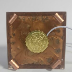 Sacred Light Orgonite Golden Amber Activation Pyramid illuminated with warm amber light